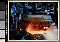 ON: Hamilton - Dofasco steel mill: Sheet steel emerges from press in rolling mill