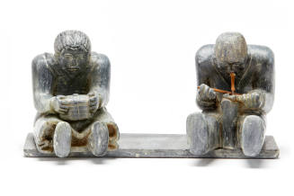 Man drilling an implement; woman with lidded basket