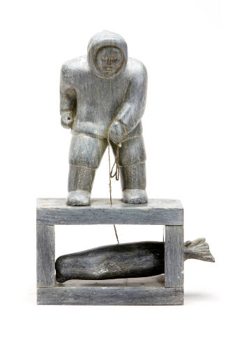 Hunter with Captured Seal Under the Ice