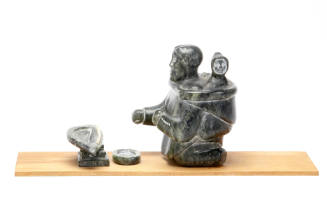 Mother and Child Kneeling at a Qulliq