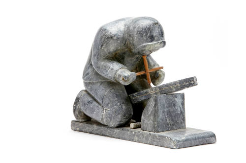 Man Drilling Holes in a Sled Runner