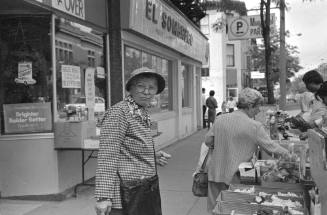 untitled (woman outside fruit stand) from the series On and Around James Street
